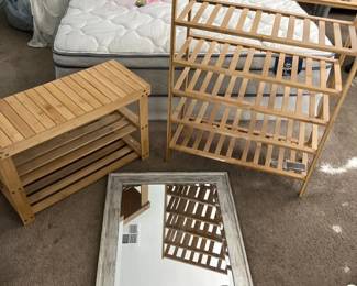 Two Wooden Shelving Units And A Mirror