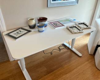 Ikea Bekant desk measures 63" x 31 1/2". Raises up and down electronically.