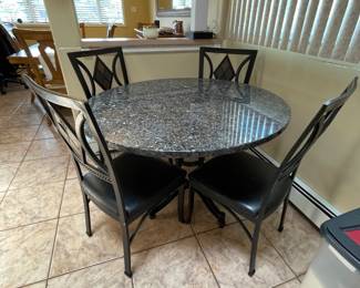 Solid Marble kitchen table with 5 chairs (1 chair missing from the picture)