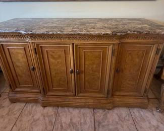 Solid Wood Breakfront with Marble Stone Top. Includes 4 cabinet doors with shelving and drawer space.