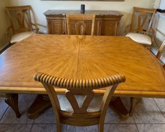 Solid Oak Dining Table Set. Includes 2 leafs for table extension, 3 table pads, and 8 matching dining chairs (2 with arm rests)