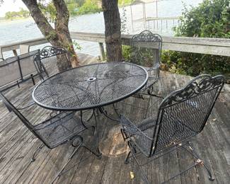 Wrought iron table and rocking chairs