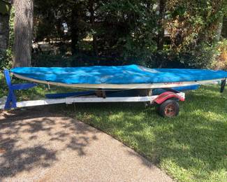 Sunfish Sailboat and trailer. Comes with mast and sails