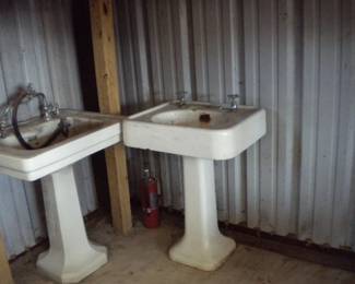 Antique sinks were in the same shop as the barber chairs