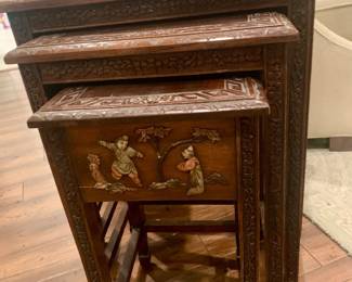 Close up of art work on this antique stacking table