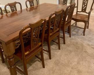6 ft Mahogany table , 2 captain chairs, and 6 side chairs --all heavily carved