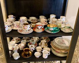 a fine early china tea cup collection--can you see the red one right in the front?--features a turn of the last century Lafayette
