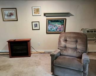 Small recliner, fireplace, prints