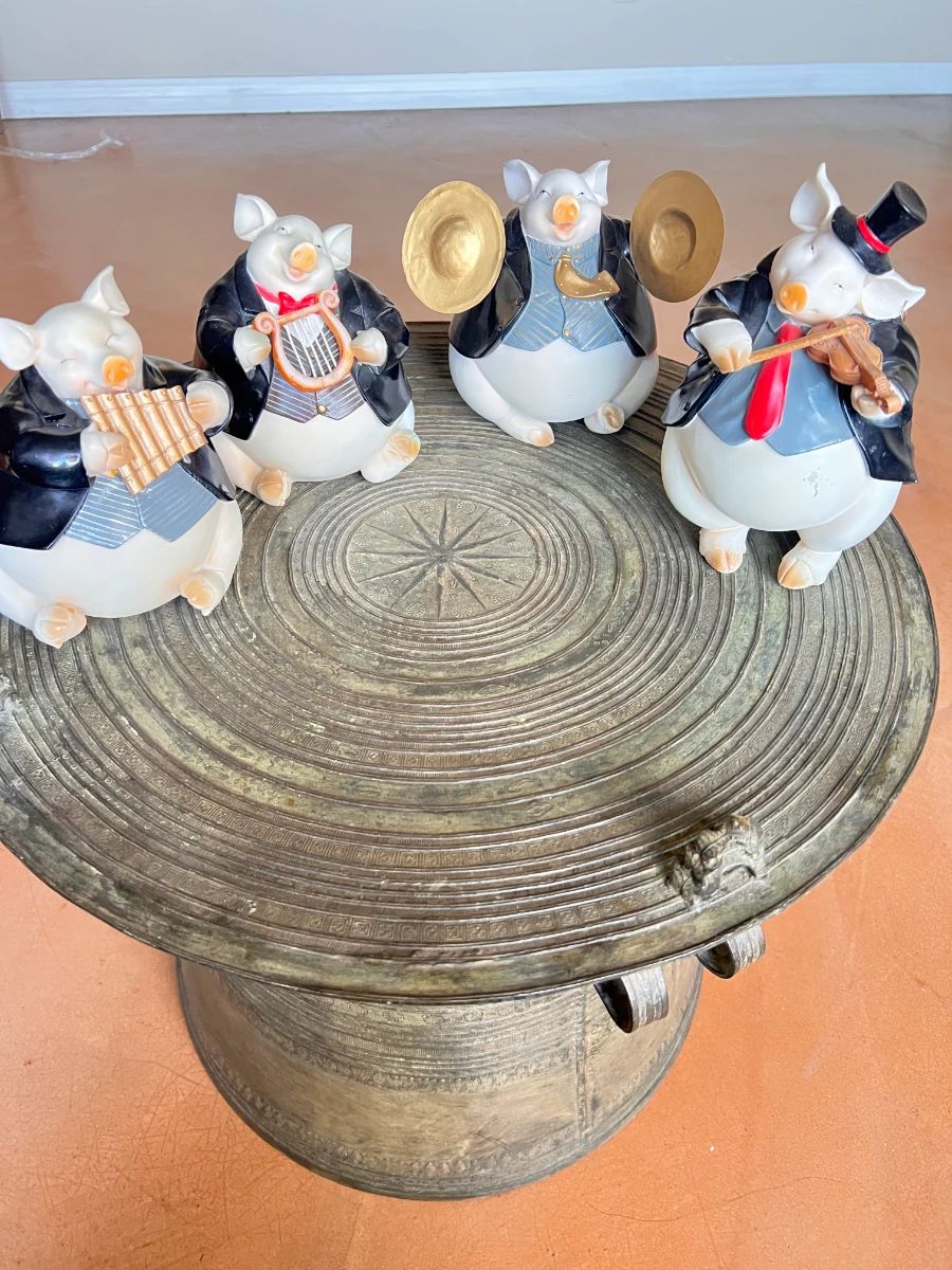 A Set of 4 Pig Musician Coin Banks
