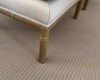 A Pair of Faux Leather Ottomans