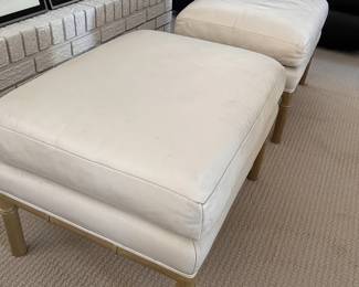 A Pair of Faux Leather Ottomans