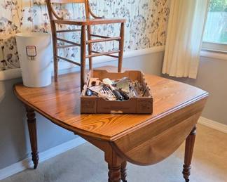 Antique Oak drop leaf table with (3) leaves.