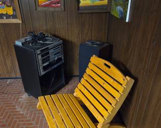 Stereo system, speakers and fold up chair.
