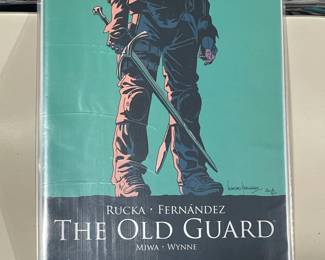 Collection Of Graphic Novels & Comics Books (The Old Guard, The Walking Dead, Steve Aoki, Etc.)