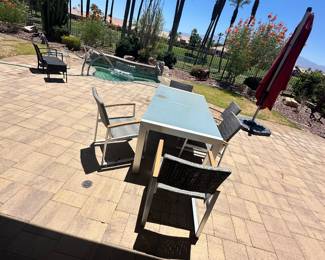 Outdoor dining set. Umbrella with weighted base.