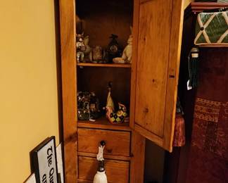 Pine cabinet full of decor