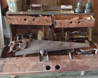 Antique carpenter's tool box. Wooden box full of vintage tools