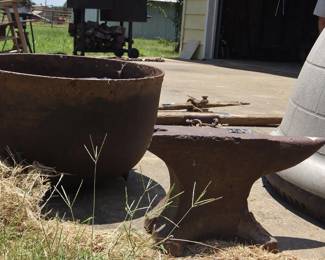 Large vintage iron boiling pot. Antique anvil