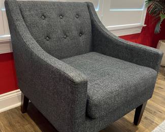 Gray cushioned chair. Perfect Condition. Never used. Gray. Dimensions: Height= 30'', Width= 25.5'', Depth= 29''.