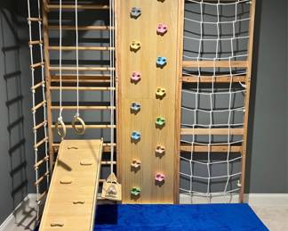Rock climbing wall set. For all ages: kids and adults. Perfect condition and barely used. Plus 3'' thick blue pad for safety. Walnut wood Rock Wall / Rope Wall / Wood Bar Ladder, Moving Ladder / Hanging Rings / Incline Climb / Pull Up Bars. You must be able to take it off our wall yourself and have your own truck. Already assembled (we paid 2 professionals for 5 hours to assemble this and buy wood planks to attach to the back to guarantee they could drill the wood directly into the house wood beams for extra strength and security (to hold the weight of anyone that used it). This will save you a lot of money having it pre assembled.