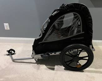 Bike Trailer for toddler. BRAND NEW! Never used. We opened it and never used it.
