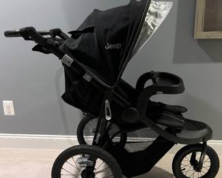 Black Stroller Jogger. Jeep brand. Folds up. Barely used. Perfect condition.