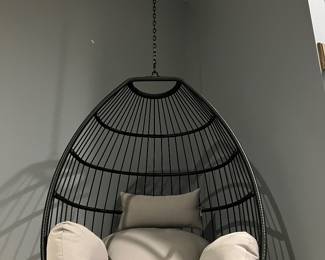 Hanging Cushioned Chair. Perfect condition. Very comfortable! Thick cushions. Swings. Sturdy. Black cage design.