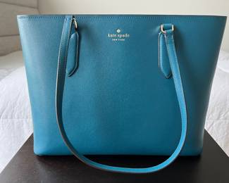 Kate Spade purse. Brand New, tag still attached. Color: "Dark Peaco". Harper refined grain leather. Dimensions: Height= 10.5'' Strap length= 9.5'', width= 13.5'', depth= 6''