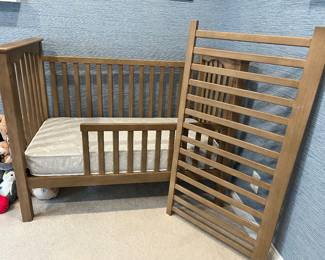Kendall Convertible Crib. Color: Seadrift. Everything is in perfect condition. Pottery Barn: Crib, Guardrail conversion attachment, and Mattress. Beautiful brown wood. Crib for babies and toddlers. Transition to toddler bed with the opening on part of one side. Attachment included. Thick mattress from Pottery Barn also included: 27.5x52x6.