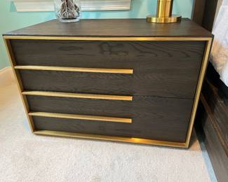2 Wood nightstands. 2 Beautiful brown wood nightstands with gold accents. Modern style. Purchased 2 for $3,200. Discoloration inside 1 drawer. I have a matching dresser if you're interested