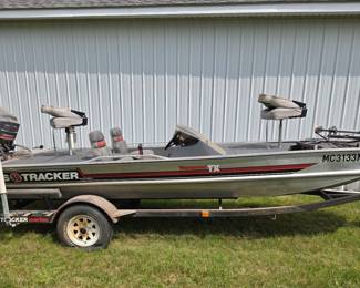Photo 1 of 6 - Available for pre sale. 1988 Bass Tracker - Tournament TX 17 Foot Mariner 60HP Mariner Motor-Oil Injected. Includes Tracker Marine Trailer. $2,600, includes electric trolling motor. Text Mike at 517-614-3089