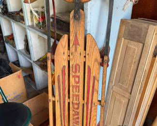 This vintage Speedaway snow sled from the Paris Manufacturing Company of South Paris, Maine dates back to the 1950s or 1960s and is a perfect reminder of snowy winters from years gone by.  Built with sturdy ash or oak slats, these sleds were made to handle years of adventures down neighborhood hills. Today, they’re just as popular as rustic décor, whether displayed on a front porch with a holiday wreath, hanging in a ski cabin, or adding vintage charm to any home.  A piece of winter nostalgia that’s just as beautiful as it is functional.