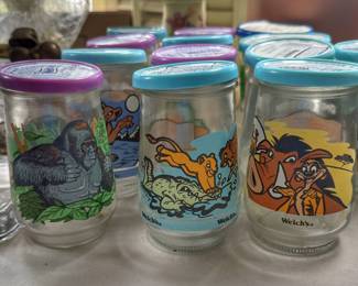 Add a touch of 1990s nostalgia to your kitchen or collection with this large lot of vintage Welch's jelly jar glasses.