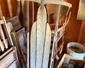 This vintage wooden sled is a stunning piece of winter history, showcasing classic craftsmanship from a bygone era.🛷 Timeless Design: Built with solid wood slats and sturdy iron runners, it features a curved steering crossbar meant for guiding down snow-covered hills.  Rustic Decor: Perfect for a cozy porch display, winter holiday setup, or as a unique focal point in a farmhouse-style home.  Whether you lean it up against the entryway or drape it with winter greenery, it adds instant nostalgic warmth to any space!