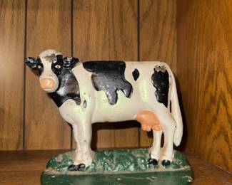 Cast iron cow door stopper