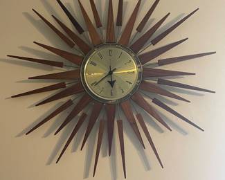 1970’s mid-century clock. Probably needs new clock moment