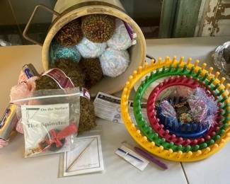 Skeins of Yarn with Knifty Knitter Rings Spinster and More In Ceramic Bucket