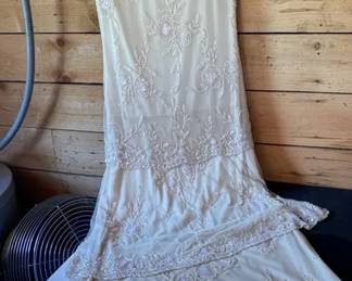Cream Colored FlapperStyle Gown With Intricate Beadwork In Floral Patterns On Lace