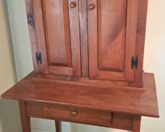 PRIMITIVE CABINET ON TABLE