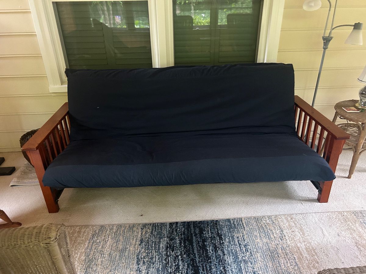 Futon with black metal frame