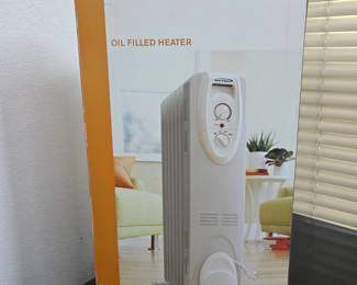 Lot #B146 - Warm Fusion HD904 Oil Filled Heater with Adjustable Thermostat & Portable Wheels