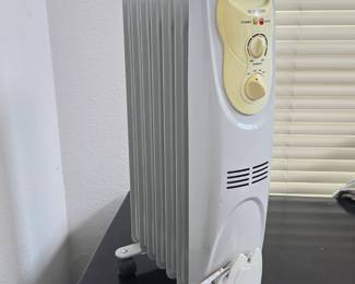 Lot #B147 - Warm Fusion Electric Oil-Filled Radiator Heater with Adjustable Thermostat and Power Indicator Lights