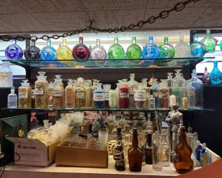 Collection of 19th CenturyPharmaceutical Bottles with label under glass & top shelf Wheaton Bottles
