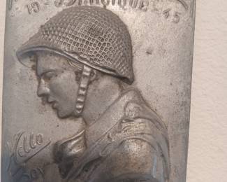 Vintage WWII-themed "Hello Boy" soldier wall plaque made of cast aluminum.