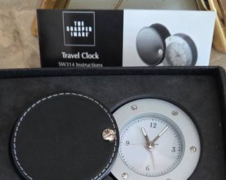 Sharper Image travel clock in leather case