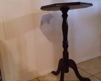 Adorable three legged wooden vintage table. Makes a