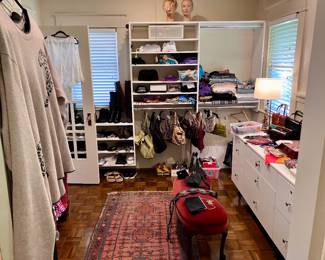 Master closet full of designer clothing