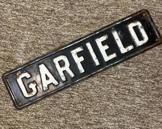 457 vintageembossedmetalsigngarfield