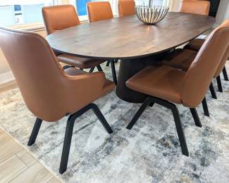 2 Stressless Arm chairs, 6 side chairs. V2 low back, Paloma leather "copper" color with black finish legs, D200 style