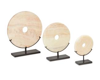 2153 Three onyx disc table items Early 21st century Comprising three circular cream onyx discs in graduated sizes, each with hole at center and raised on a black enameled metal stand 3 pieces Largest disc: 15.75" Dia.; Smallest disc: 7.875" Dia. Estimate: $100 - $200